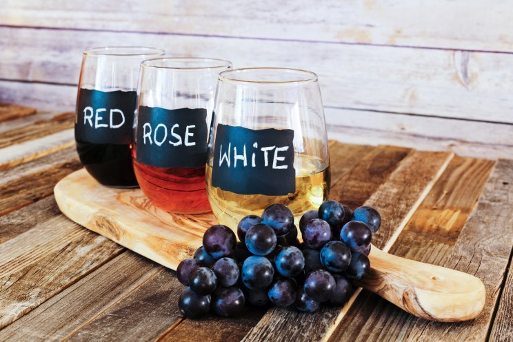 Three color wine flight in label glasses close up